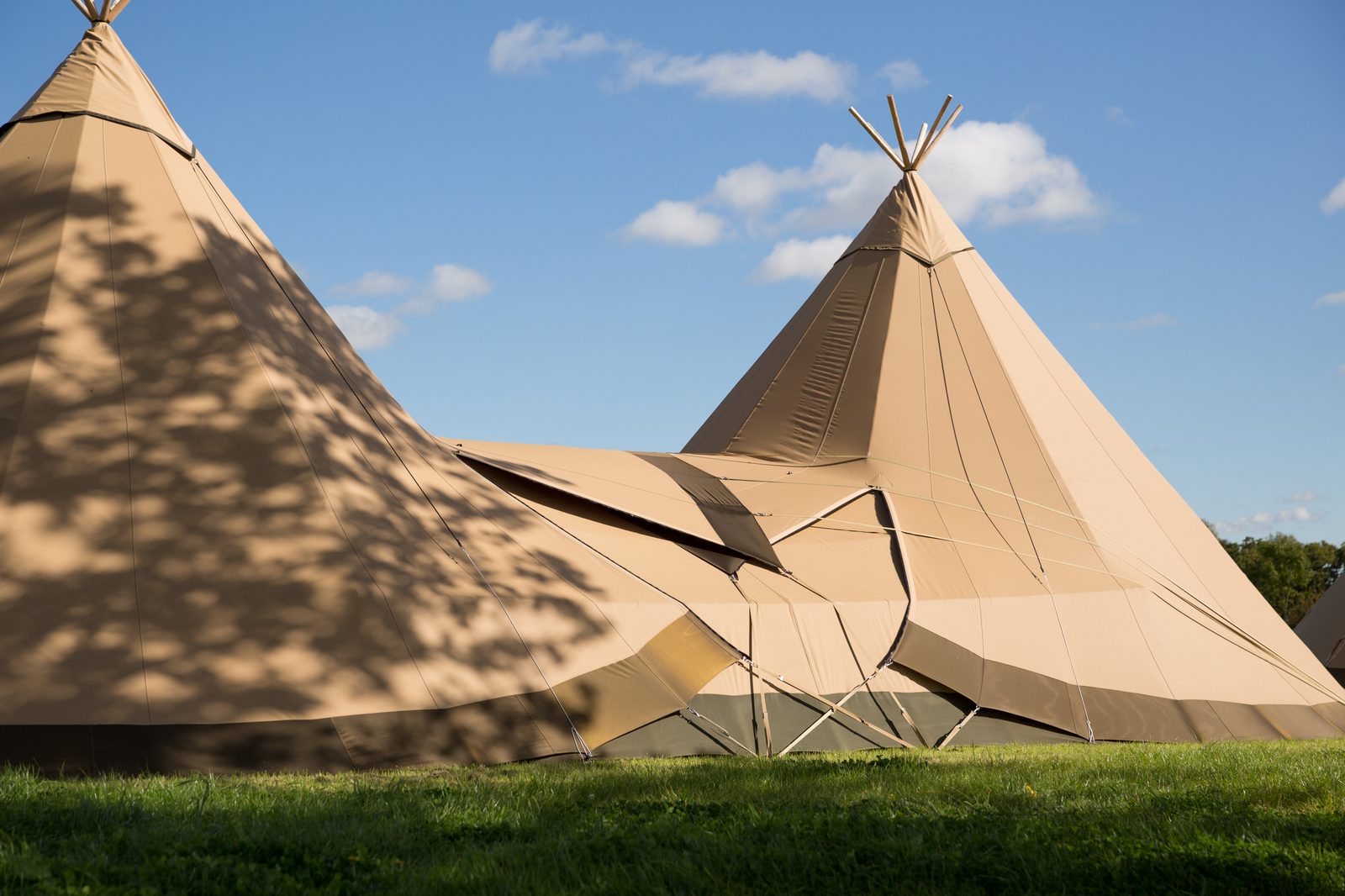 Two Beehive Cirrus 40 tipis linked together — outdoor classrooms for Cheshire schools and nurseries