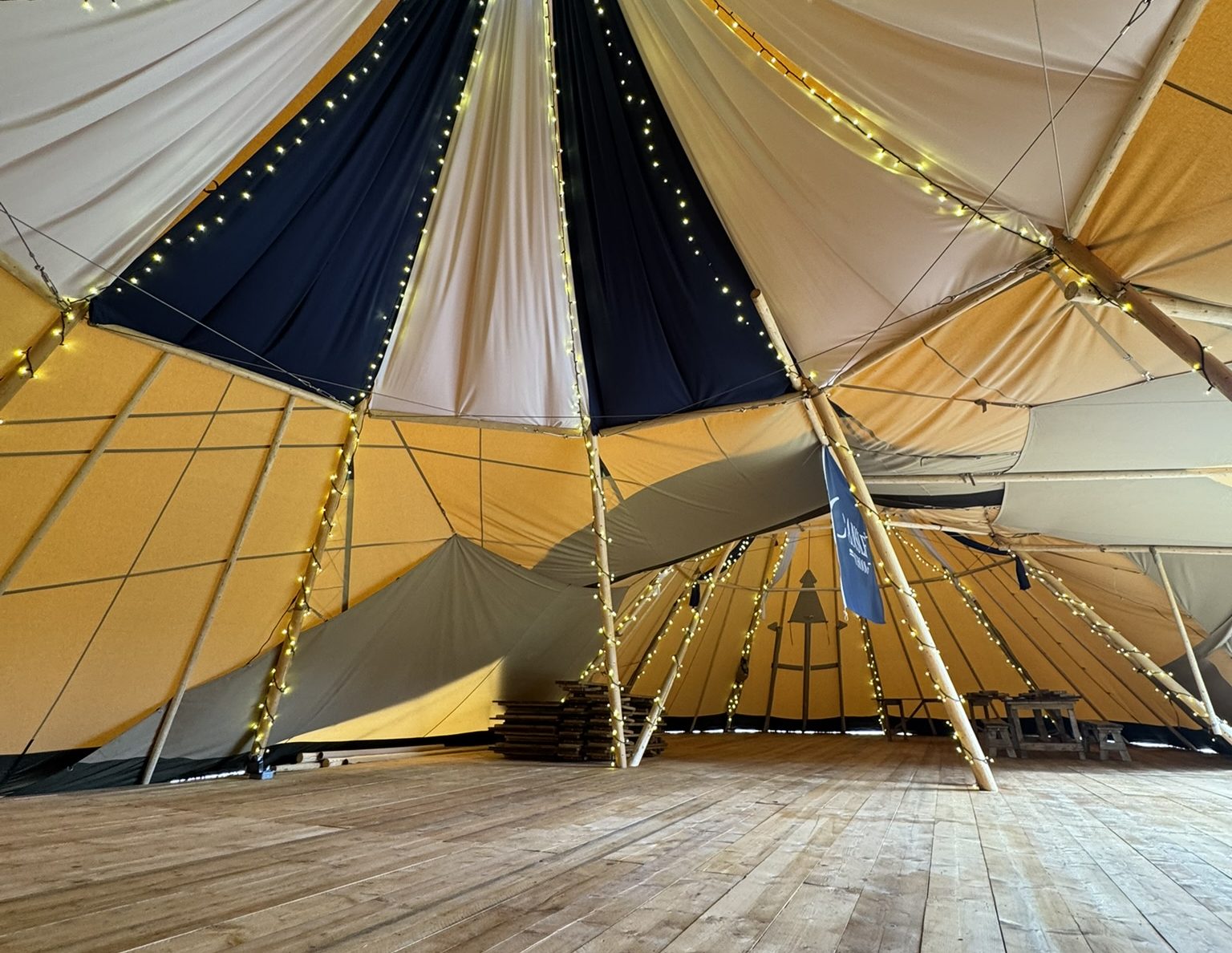 Inside the Cransley Canopy: linked tipi classrooms dressed in the school&rsquo;s dark blue and white