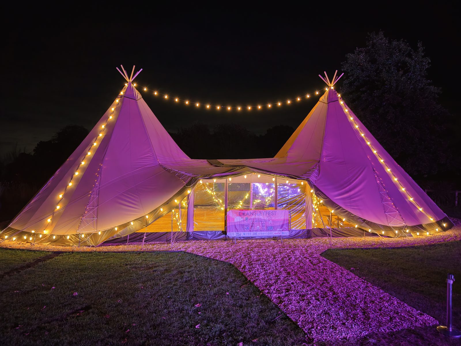 The Campus at Cransley School, lit up at night with festoon lights during the school&rsquo;s festival
