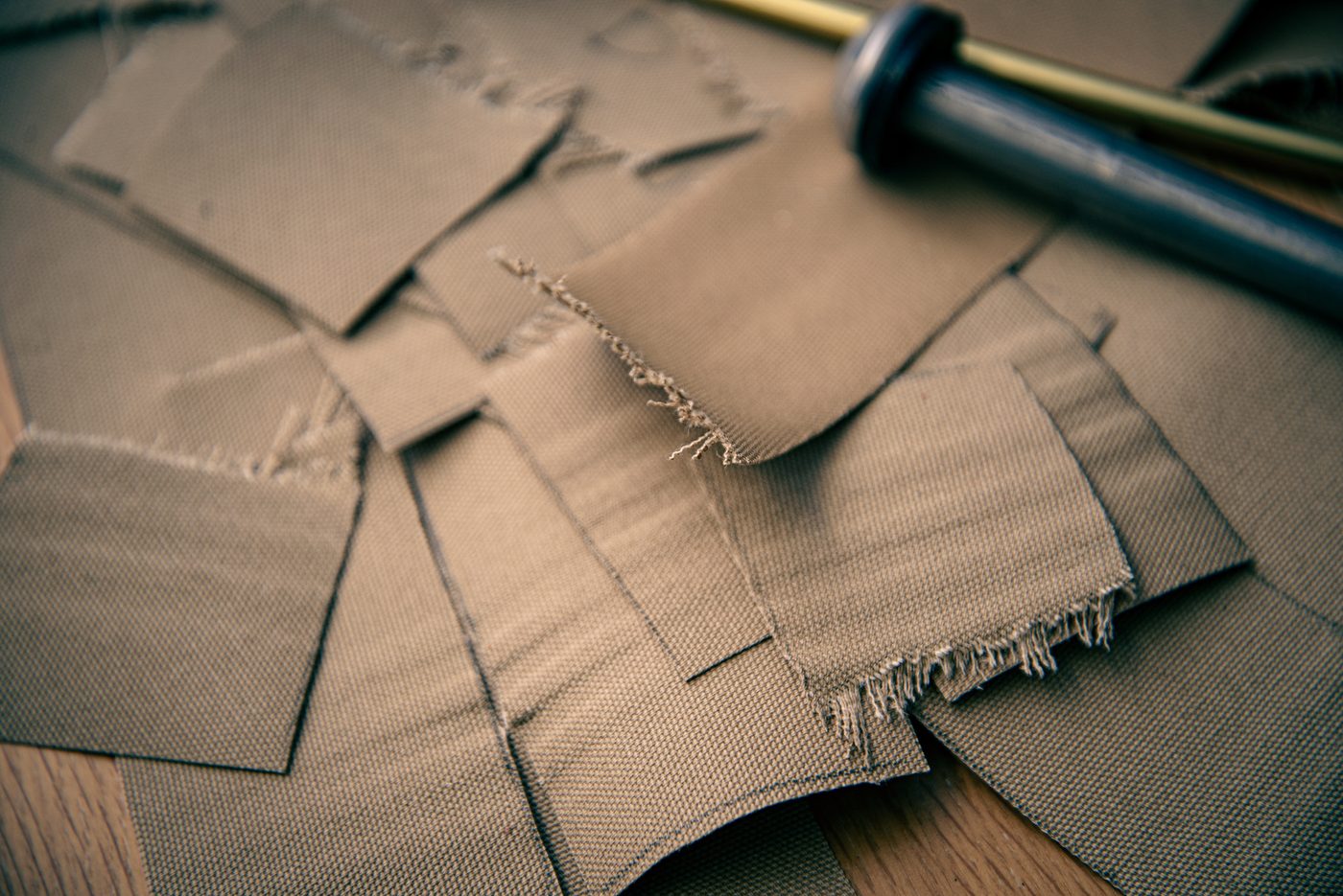 Heavy-duty Tentipi canvas fabric undergoing precision testing for outdoor classroom strength and year-round weatherproof durability