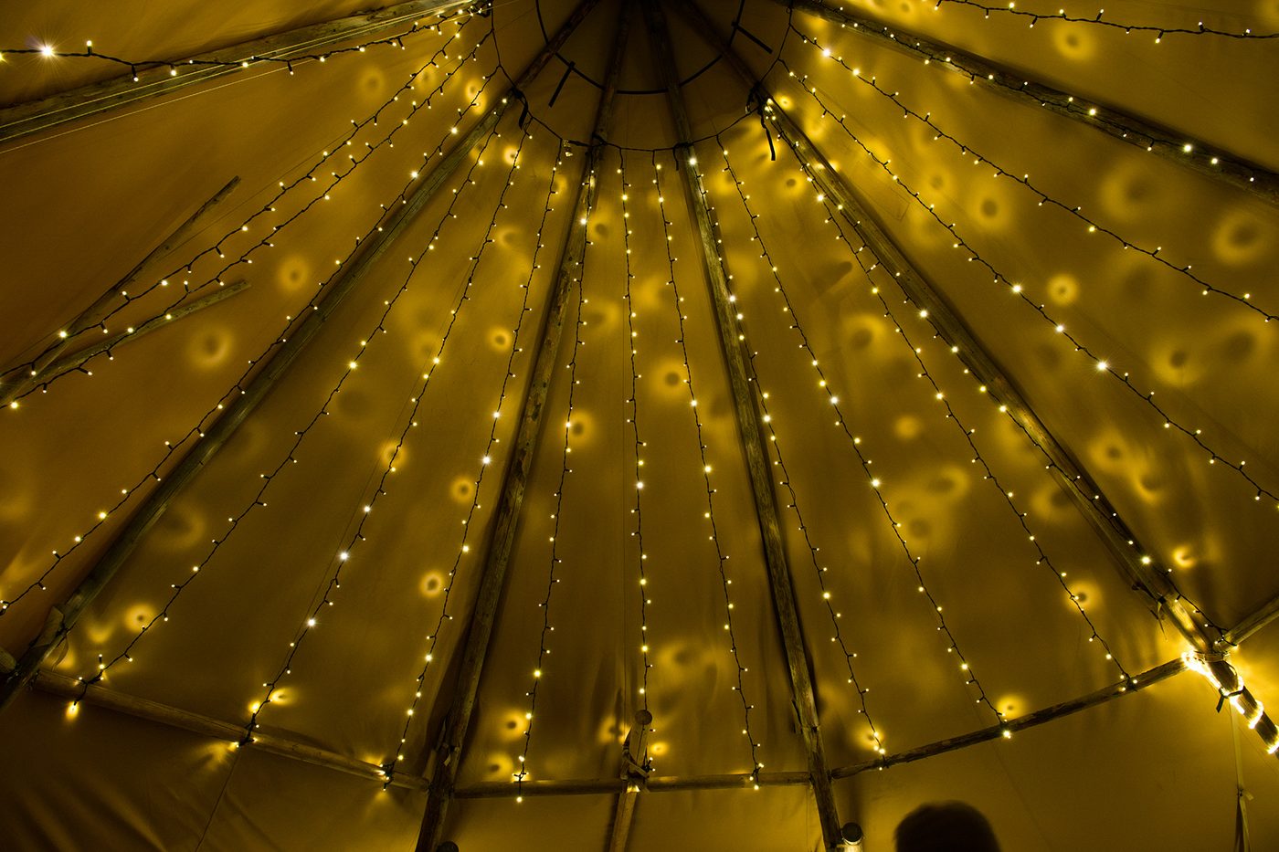 Atmospheric tipi interior with fairy lights for calm SEND learning