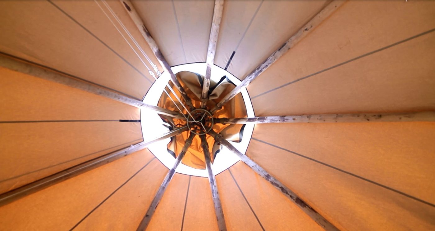 Precision-engineered ventilation and smoke cap system on Nordic tipi outdoor classroom structure for safe year-round use